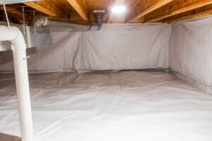 Encapsulated crawl space with a sealed liner on the walls and floor in an Ontario home.